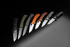 Various folding pocket knives on a dark back. A versatile pocket tool and self-defense tool. photo