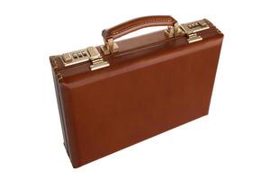 Brown leather suitcase with combination lock and gold locks isolated on white background. Briefcase for important business documents and papers. photo