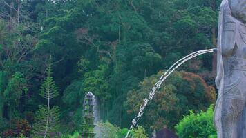 Tranquil Garden with Stone Statue and Fountain video