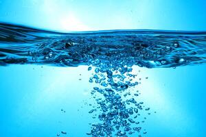 Fresh Water With Underwater Bubbles Texture on a Blue Background Close-up Abstract Liquid Bubbles Aqua Design Wallpaper photo