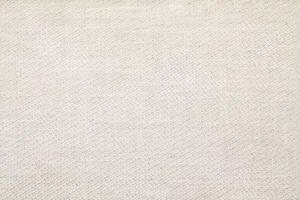 Natural Linen Material Textile Canvas Fabric Texture Background Close-up Detail of Fabric Natural Color Hemp Material Pattern Design Wallpaper. Can be Used as Background or For Graphic Design photo