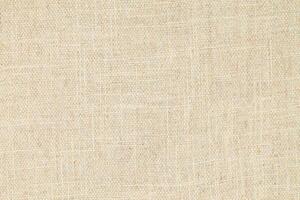 Natural Linen Material Textile Canvas Fabric Texture Background Close-up Detail of Fabric Natural Color Hemp Material Pattern Design Wallpaper. Can be Used as Background or For Graphic Design photo