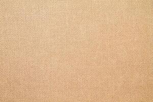 Natural Linen Material Textile Canvas Fabric Texture Background Close-up Detail of Fabric Natural Color Hemp Material Pattern Design Wallpaper. Can be Used as Background or For Graphic Design photo