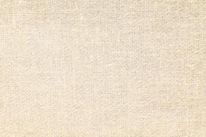 Natural Linen Material Textile Canvas Fabric Texture Background Close-up Detail of Fabric Natural Color Hemp Material Pattern Design Wallpaper. Can be Used as Background or For Graphic Design photo
