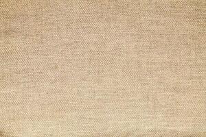 Natural Linen Material Textile Canvas Fabric Texture Background Close-up Detail of Fabric Natural Color Hemp Material Pattern Design Wallpaper. Can be Used as Background or For Graphic Design photo