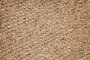 Natural Linen Material Textile Canvas Fabric Texture Background Close-up Detail of Fabric Natural Color Hemp Material Pattern Design Wallpaper. Can be Used as Background or For Graphic Design photo