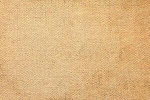 Natural Linen Material Textile Canvas Fabric Texture Background Close-up Detail of Fabric Natural Color Hemp Material Pattern Design Wallpaper. Can be Used as Background or For Graphic Design photo