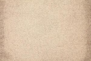 Natural Linen Material Textile Canvas Fabric Texture Background Close-up Detail of Fabric Natural Color Hemp Material Pattern Design Wallpaper. Can be Used as Background or For Graphic Design photo