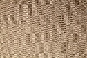 Natural Linen Material Textile Canvas Fabric Texture Background Close-up Detail of Fabric Natural Color Hemp Material Pattern Design Wallpaper. Can be Used as Background or For Graphic Design photo