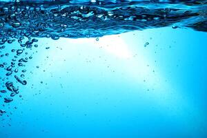 Fresh Water With Underwater Bubbles Texture on a Blue Background Close-up Abstract Liquid Bubbles Aqua Design Wallpaper photo
