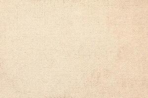 Natural Linen Material Textile Canvas Fabric Texture Background Close-up Detail of Fabric Natural Color Hemp Material Pattern Design Wallpaper. Can be Used as Background or For Graphic Design photo