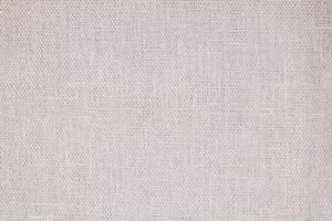 Natural Linen Material Textile Canvas Fabric Texture Background Close-up Detail of Fabric Natural Color Hemp Material Pattern Design Wallpaper. Can be Used as Background or For Graphic Design photo