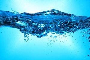 Fresh Water With Underwater Bubbles Texture on a Blue Background Close-up Abstract Liquid Bubbles Aqua Design Wallpaper photo