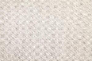 Natural Linen Material Textile Canvas Fabric Texture Background Close-up Detail of Fabric Natural Color Hemp Material Pattern Design Wallpaper. Can be Used as Background or For Graphic Design photo
