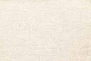 Natural Linen Material Textile Canvas Fabric Texture Background Close-up Detail of Fabric Natural Color Hemp Material Pattern Design Wallpaper. Can be Used as Background or For Graphic Design photo