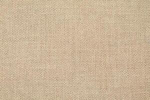 Natural Linen Material Textile Canvas Fabric Texture Background Close-up Detail of Fabric Natural Color Hemp Material Pattern Design Wallpaper. Can be Used as Background or For Graphic Design photo