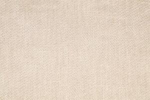 Natural Linen Material Textile Canvas Fabric Texture Background Close-up Detail of Fabric Natural Color Hemp Material Pattern Design Wallpaper. Can be Used as Background or For Graphic Design photo