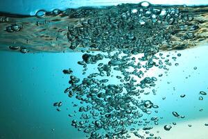 Fresh Water With Underwater Bubbles Texture on a Blue Background Close-up Abstract Liquid Bubbles Aqua Design Wallpaper photo