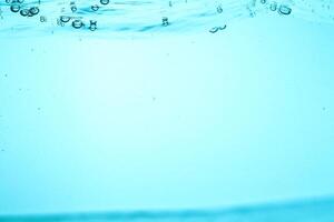 Fresh Water With Underwater Bubbles Texture on a Blue Background Close-up Abstract Liquid Bubbles Aqua Design Wallpaper photo