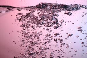 Fresh Water With Underwater Bubbles Texture on a Blue Background Close-up Abstract Liquid Bubbles Aqua Design Wallpaper photo