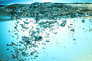 Fresh Water With Underwater Bubbles Texture on a Blue Background Close-up Abstract Liquid Bubbles Aqua Design Wallpaper photo