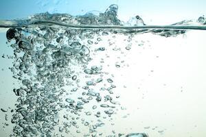 Fresh Water With Underwater Bubbles Texture on a Blue Background Close-up Abstract Liquid Bubbles Aqua Design Wallpaper photo