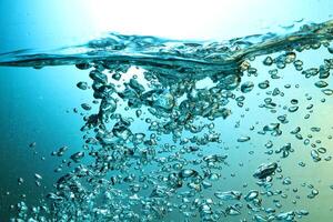 Fresh Water With Underwater Bubbles Texture on a Blue Background Close-up Abstract Liquid Bubbles Aqua Design Wallpaper photo