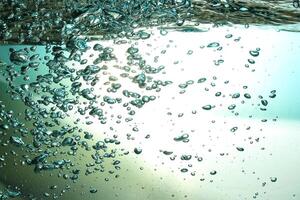 Fresh Water With Underwater Bubbles Texture on a Blue Background Close-up Abstract Liquid Bubbles Aqua Design Wallpaper photo