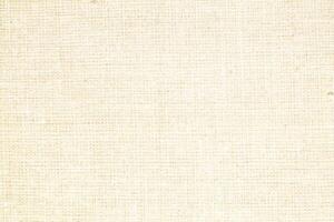 Natural Linen Material Textile Canvas Fabric Texture Background Close-up Detail of Fabric Natural Color Hemp Material Pattern Design Wallpaper. Can be Used as Background or For Graphic Design photo