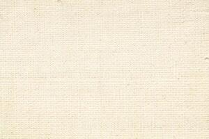 Natural Linen Material Textile Canvas Fabric Texture Background Close-up Detail of Fabric Natural Color Hemp Material Pattern Design Wallpaper. Can be Used as Background or For Graphic Design photo
