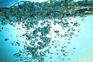 Fresh Water With Underwater Bubbles Texture on a Blue Background Close-up Abstract Liquid Bubbles Aqua Design Wallpaper photo