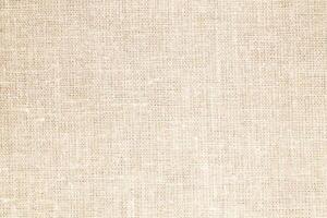Natural Linen Material Textile Canvas Fabric Texture Background Close-up Detail of Fabric Natural Color Hemp Material Pattern Design Wallpaper. Can be Used as Background or For Graphic Design photo