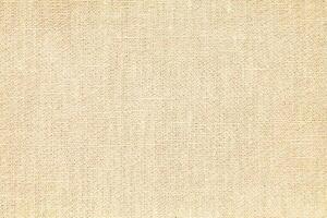 Natural Linen Material Textile Canvas Fabric Texture Background Close-up Detail of Fabric Natural Color Hemp Material Pattern Design Wallpaper. Can be Used as Background or For Graphic Design photo