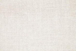 Natural Linen Material Textile Canvas Fabric Texture Background Close-up Detail of Fabric Natural Color Hemp Material Pattern Design Wallpaper. Can be Used as Background or For Graphic Design photo