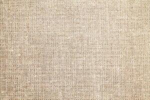 Natural Linen Material Textile Canvas Fabric Texture Background Close-up Detail of Fabric Natural Color Hemp Material Pattern Design Wallpaper. Can be Used as Background or For Graphic Design photo