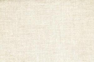 Natural Linen Material Textile Canvas Fabric Texture Background Close-up Detail of Fabric Natural Color Hemp Material Pattern Design Wallpaper. Can be Used as Background or For Graphic Design photo