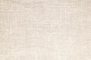 Natural Linen Material Textile Canvas Fabric Texture Background Close-up Detail of Fabric Natural Color Hemp Material Pattern Design Wallpaper. Can be Used as Background or For Graphic Design photo