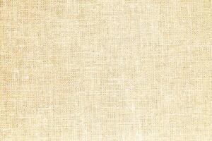 Natural Linen Material Textile Canvas Fabric Texture Background Close-up Detail of Fabric Natural Color Hemp Material Pattern Design Wallpaper. Can be Used as Background or For Graphic Design photo