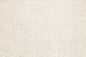 Natural Linen Material Textile Canvas Fabric Texture Background Close-up Detail of Fabric Natural Color Hemp Material Pattern Design Wallpaper. Can be Used as Background or For Graphic Design photo
