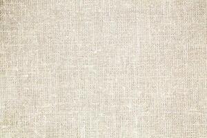 Natural Linen Material Textile Canvas Fabric Texture Background Close-up Detail of Fabric Natural Color Hemp Material Pattern Design Wallpaper. Can be Used as Background or For Graphic Design photo