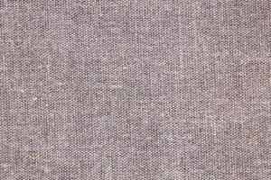 Natural Linen Material Textile Canvas Fabric Texture Background Close-up Detail of Fabric Natural Color Hemp Material Pattern Design Wallpaper. Can be Used as Background or For Graphic Design photo