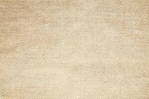 Natural Linen Material Textile Canvas Fabric Texture Background Close-up Detail of Fabric Natural Color Hemp Material Pattern Design Wallpaper. Can be Used as Background or For Graphic Design photo