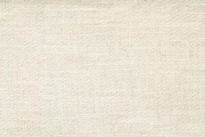 Natural Linen Material Textile Canvas Fabric Texture Background Close-up Detail of Fabric Natural Color Hemp Material Pattern Design Wallpaper. Can be Used as Background or For Graphic Design photo