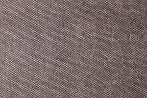 Natural Linen Material Textile Canvas Fabric Texture Background Close-up Detail of Fabric Natural Color Hemp Material Pattern Design Wallpaper. Can be Used as Background or For Graphic Design photo