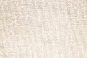 Natural Linen Material Textile Canvas Fabric Texture Background Close-up Detail of Fabric Natural Color Hemp Material Pattern Design Wallpaper. Can be Used as Background or For Graphic Design photo