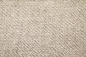 Natural Linen Material Textile Canvas Fabric Texture Background Close-up Detail of Fabric Natural Color Hemp Material Pattern Design Wallpaper. Can be Used as Background or For Graphic Design photo