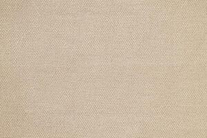 Natural Linen Material Textile Canvas Fabric Texture Background Close-up Detail of Fabric Natural Color Hemp Material Pattern Design Wallpaper. Can be Used as Background or For Graphic Design photo