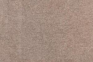 Natural Linen Material Textile Canvas Fabric Texture Background Close-up Detail of Fabric Natural Color Hemp Material Pattern Design Wallpaper. Can be Used as Background or For Graphic Design photo