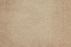 Natural Linen Material Textile Canvas Fabric Texture Background Close-up Detail of Fabric Natural Color Hemp Material Pattern Design Wallpaper. Can be Used as Background or For Graphic Design photo