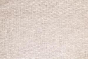 Natural Linen Material Textile Canvas Fabric Texture Background Close-up Detail of Fabric Natural Color Hemp Material Pattern Design Wallpaper. Can be Used as Background or For Graphic Design photo